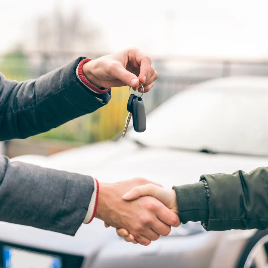 two-people-reaching-an-agreement-about-a-car-sale-royalty-free-image-1665671206